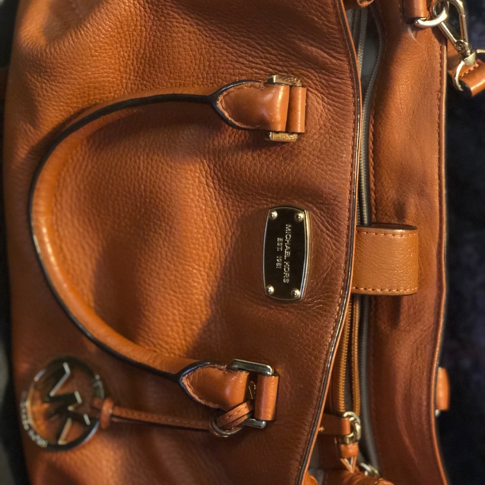 Michael Kors burnt orange crossbody bag.